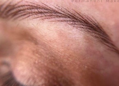 Close-up of perfectly shaped eyebrows showcasing microblading at JKA Glamour Beauty, Bray, County Dublin, IE.