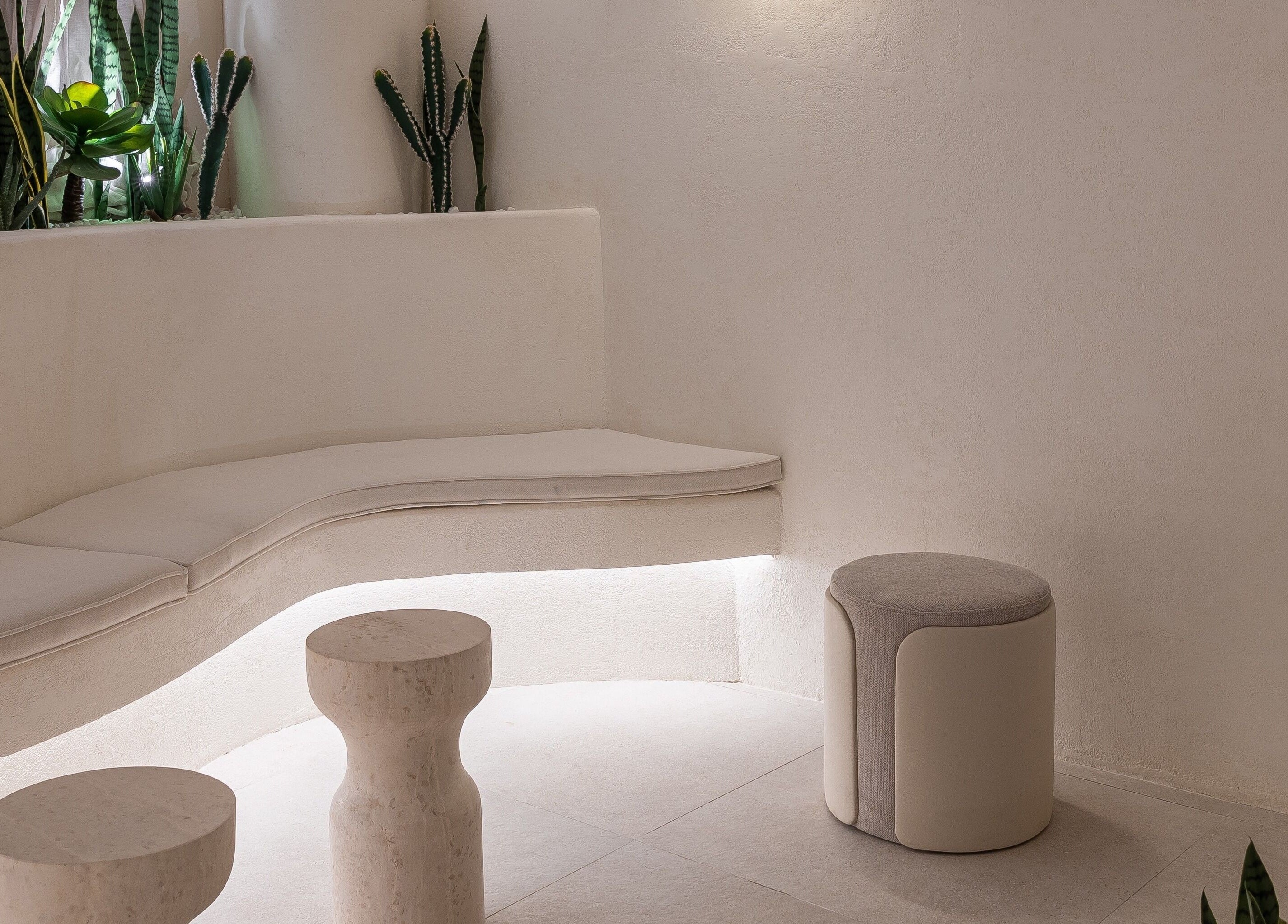 Elegant seating area at Treat Men's Luxury Spa, Riyadh, Riyadh Province, SA with modern decor and plants.