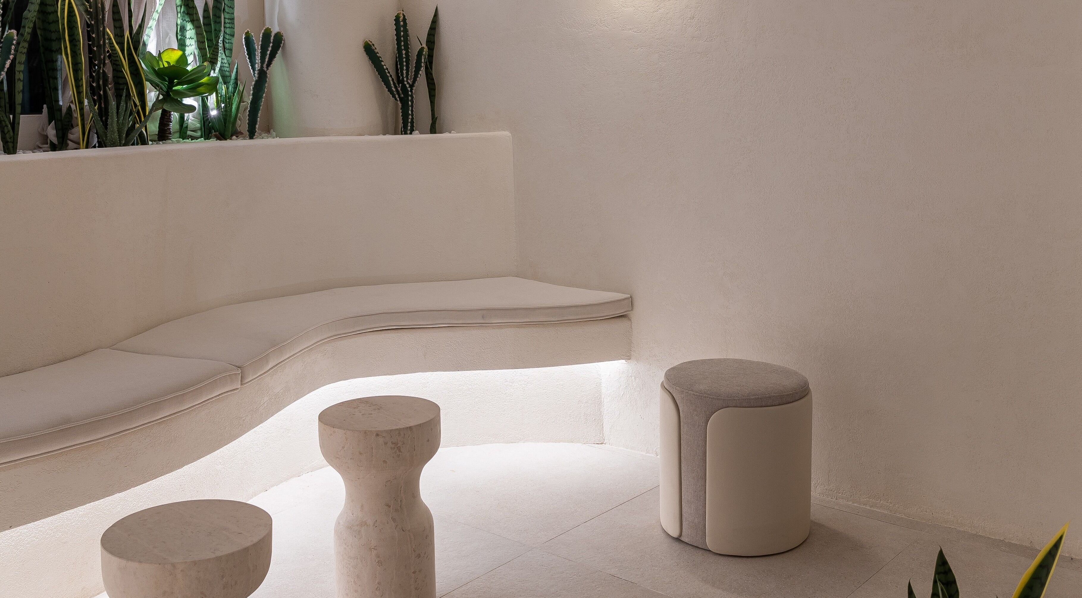 Elegant seating area at Treat Men's Luxury Spa, Riyadh, Riyadh Province, SA with modern decor and plants.