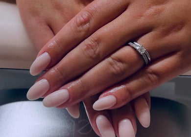 Manicured hands with rings at Gossip & Glamour, Chippenham, England, GB.
