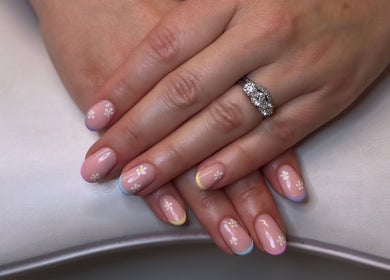 Elegant floral nail art at Gossip & Glamour, Chippenham, England, GB.