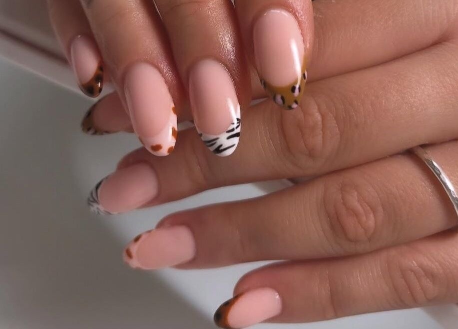 Stylish animal print nail art at Gossip & Glamour, Chippenham, England, GB. Perfect blend of modern nail trends.