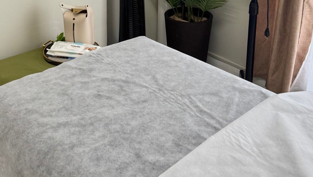 Cozy treatment bed at Lūmena Studios, Kingston, St. Andrew Parish, JM, perfect for relaxation and rejuvenation.