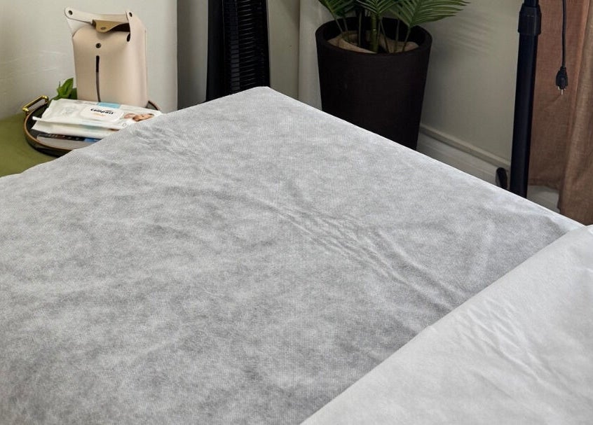 Cozy treatment bed at Lūmena Studios, Kingston, St. Andrew Parish, JM, perfect for relaxation and rejuvenation.