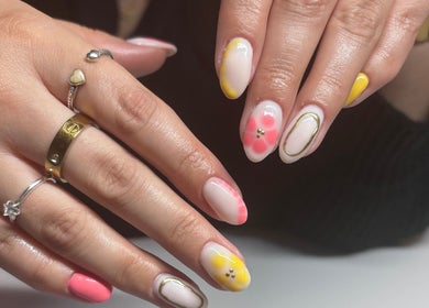 Elegant floral nail art at Freyas Beauty in Bream, England, GB showcasing vibrant designs.
