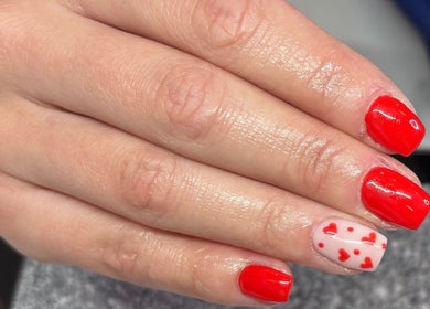 Red and pink heart nail design at Freyas Beauty, Bream, England, GB showcasing creativity and elegance.