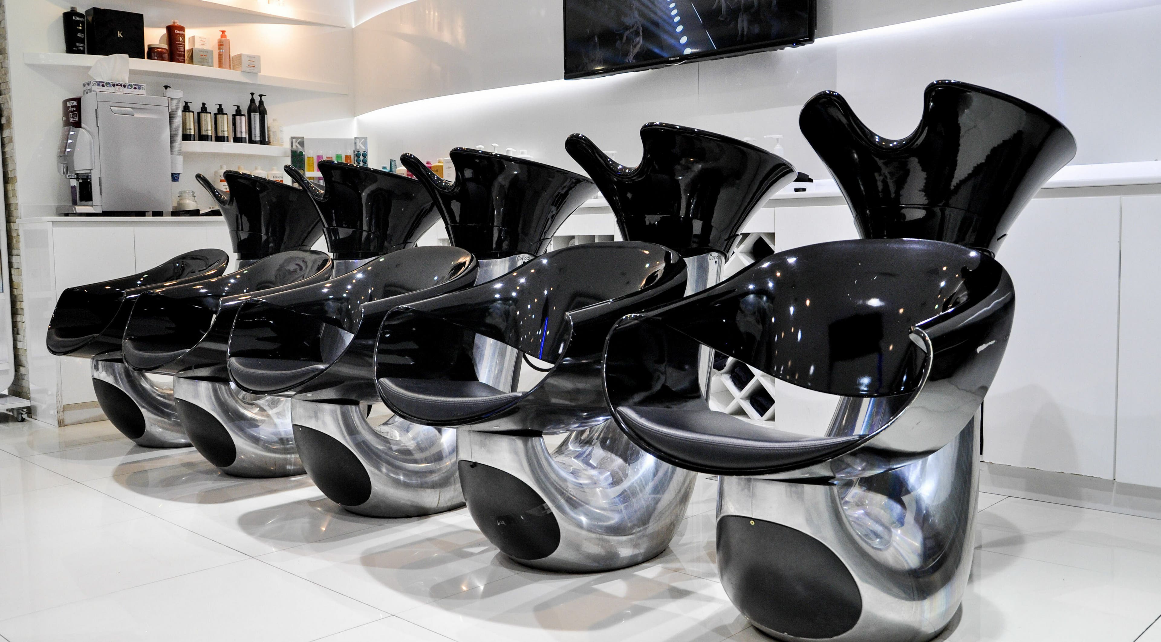 Modern wash stations at Blown Away Saloon, Dubai, Dubai, AE offer a sleek and luxurious salon experience.