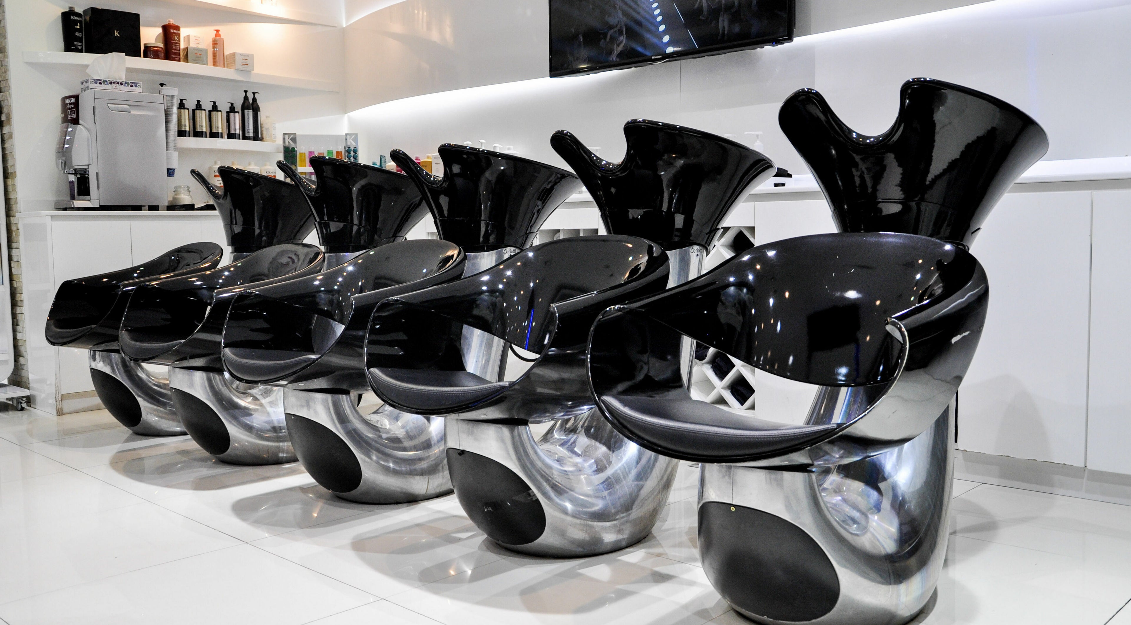 Modern wash stations at Blown Away Saloon, Dubai, Dubai, AE offer a sleek and luxurious salon experience.