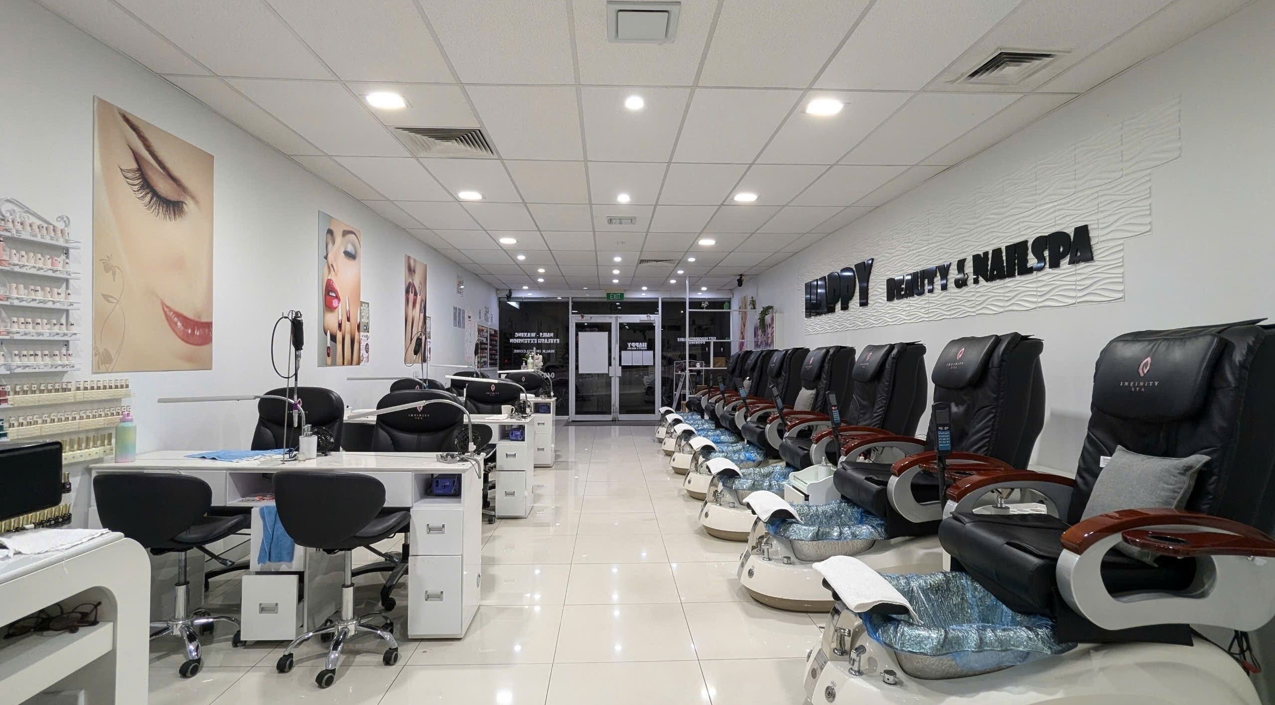 Modern interior of HAPPY Beauty & Nailspa, Melbourne, Victoria, AU with manicure and pedicure stations.