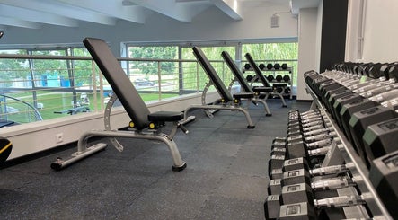 Modern gym with dumbbells and benches at Vantis Sporta un veselības centrs, Rīga, LV.