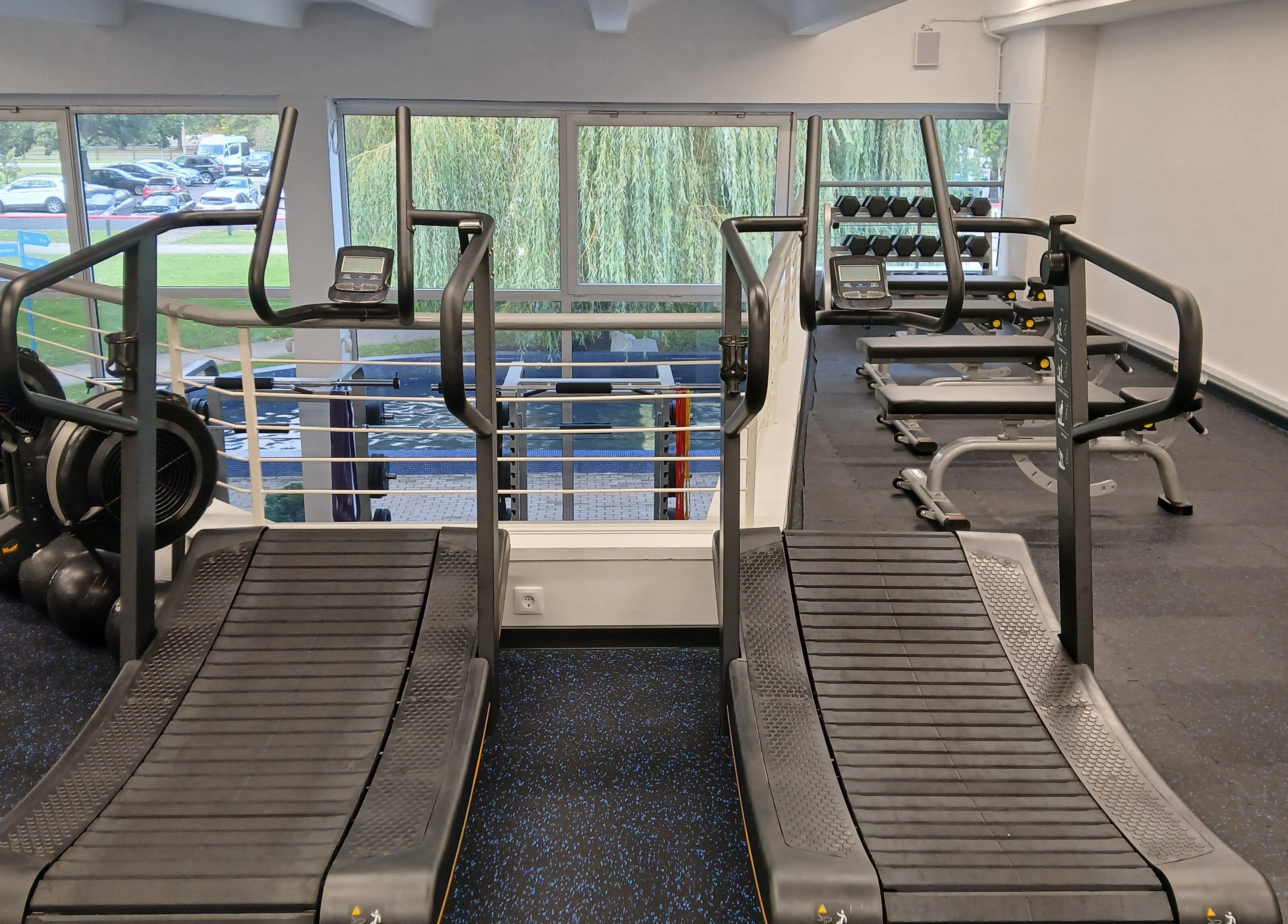 Treadmills at Vantis Sporta un veselības centrs in Rīga, LV offer scenic gym views.