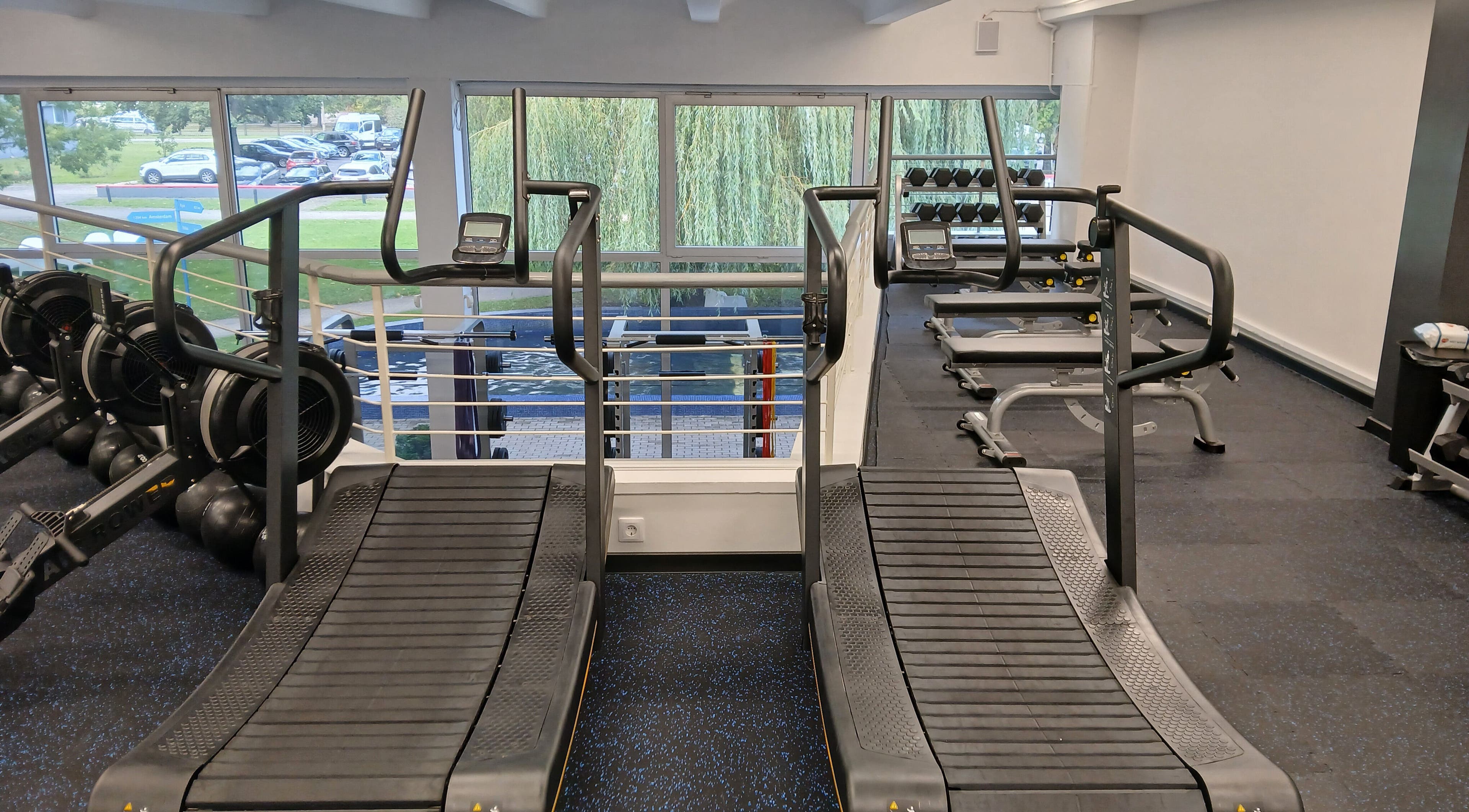 Treadmills at Vantis Sporta un veselības centrs in Rīga, LV offer scenic gym views.