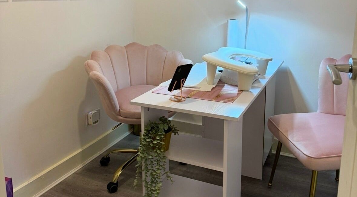 Elegant nail station at Nails by Cait, Prestwich, England, GB with plush chairs and modern decor.