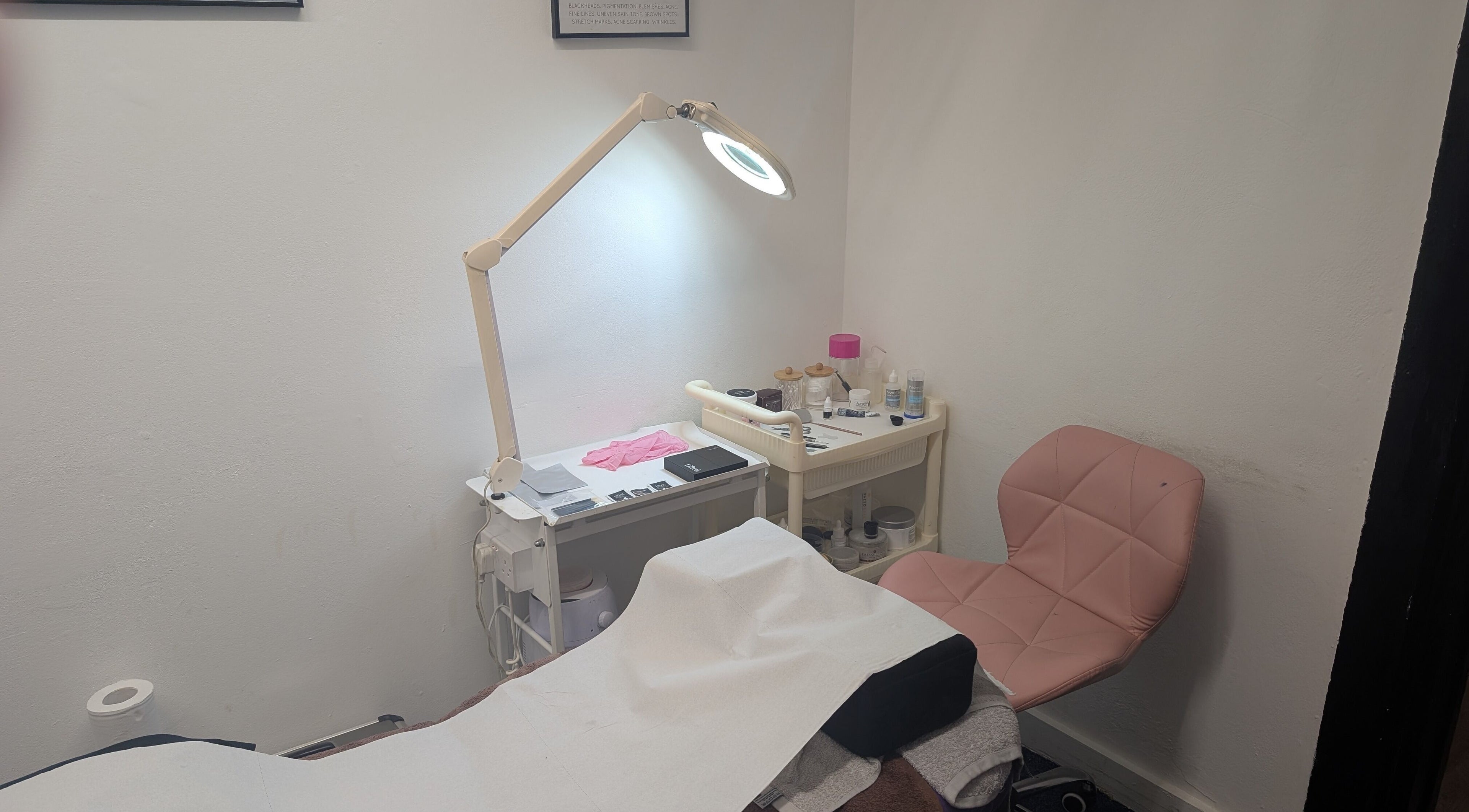 Cozy beauty treatment room at The Beauty Boutique in Littlehampton, England, GB with soft lighting.