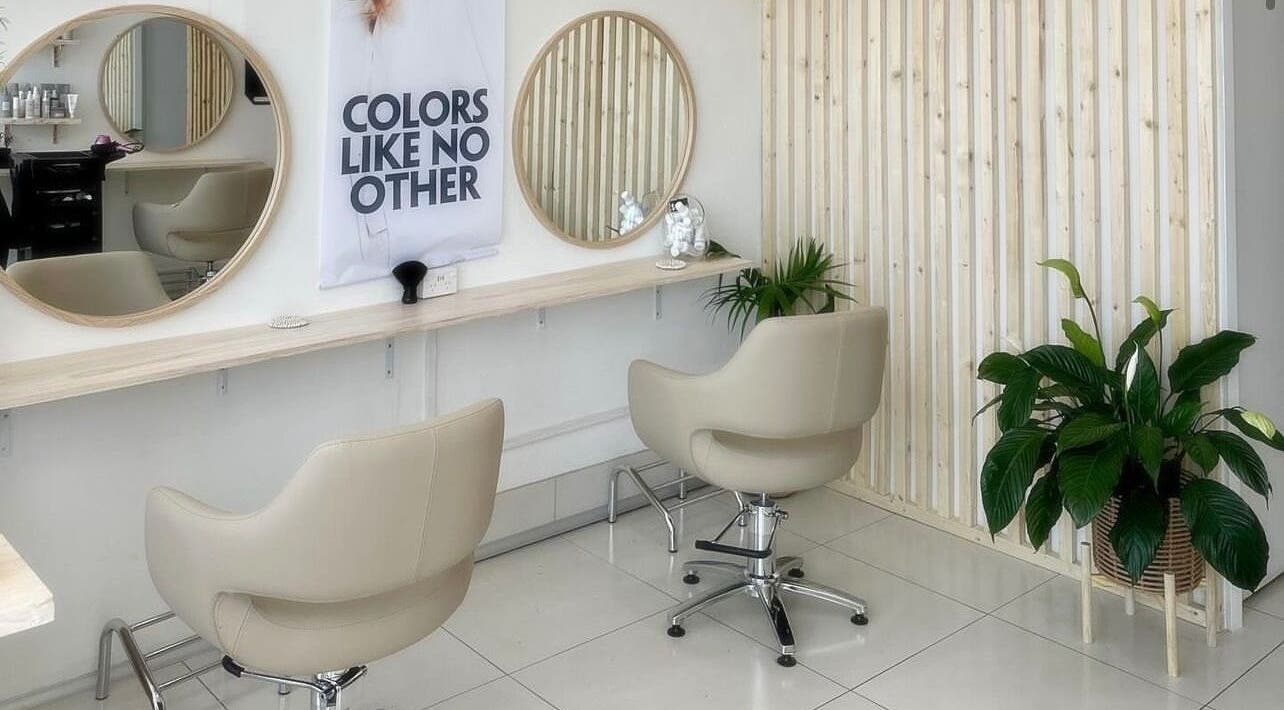 Modern salon chairs and mirrors at Tease by Laura, Budgewoi, New South Wales, AU, with elegant decor.