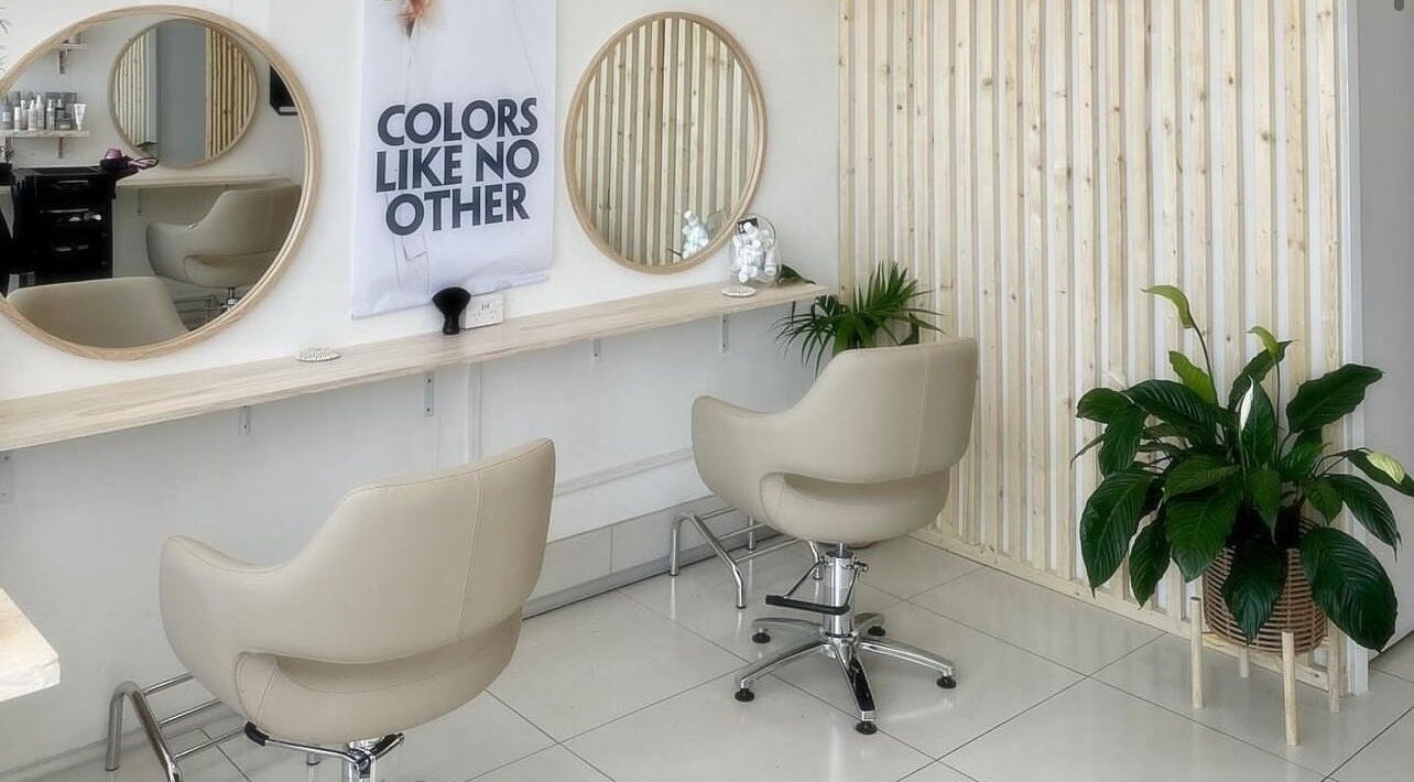 Modern salon chairs and mirrors at Tease by Laura, Budgewoi, New South Wales, AU, with elegant decor.