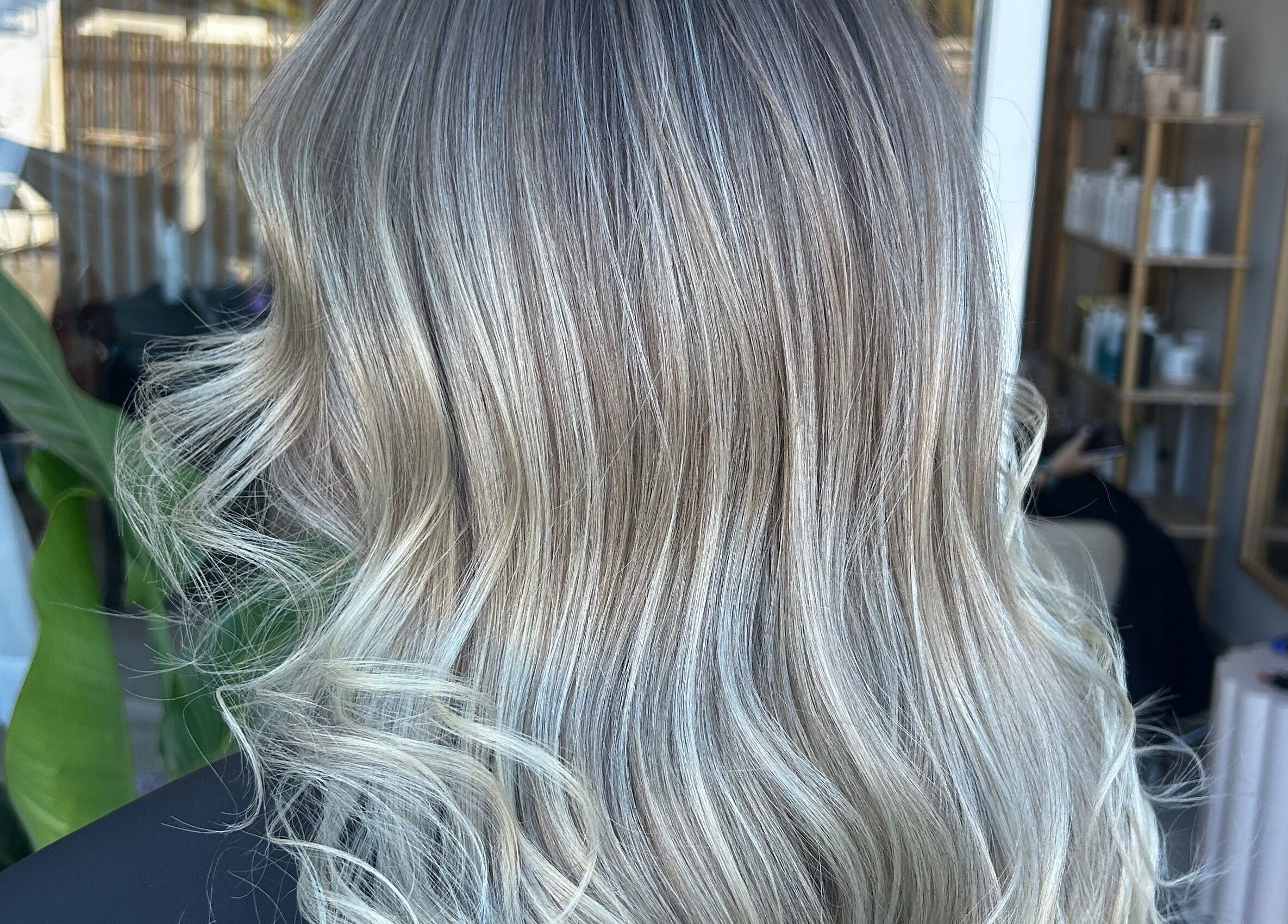 Blonde wavy hair styled at Tease by Laura, Budgewoi, New South Wales, AU, reflecting natural elegance.