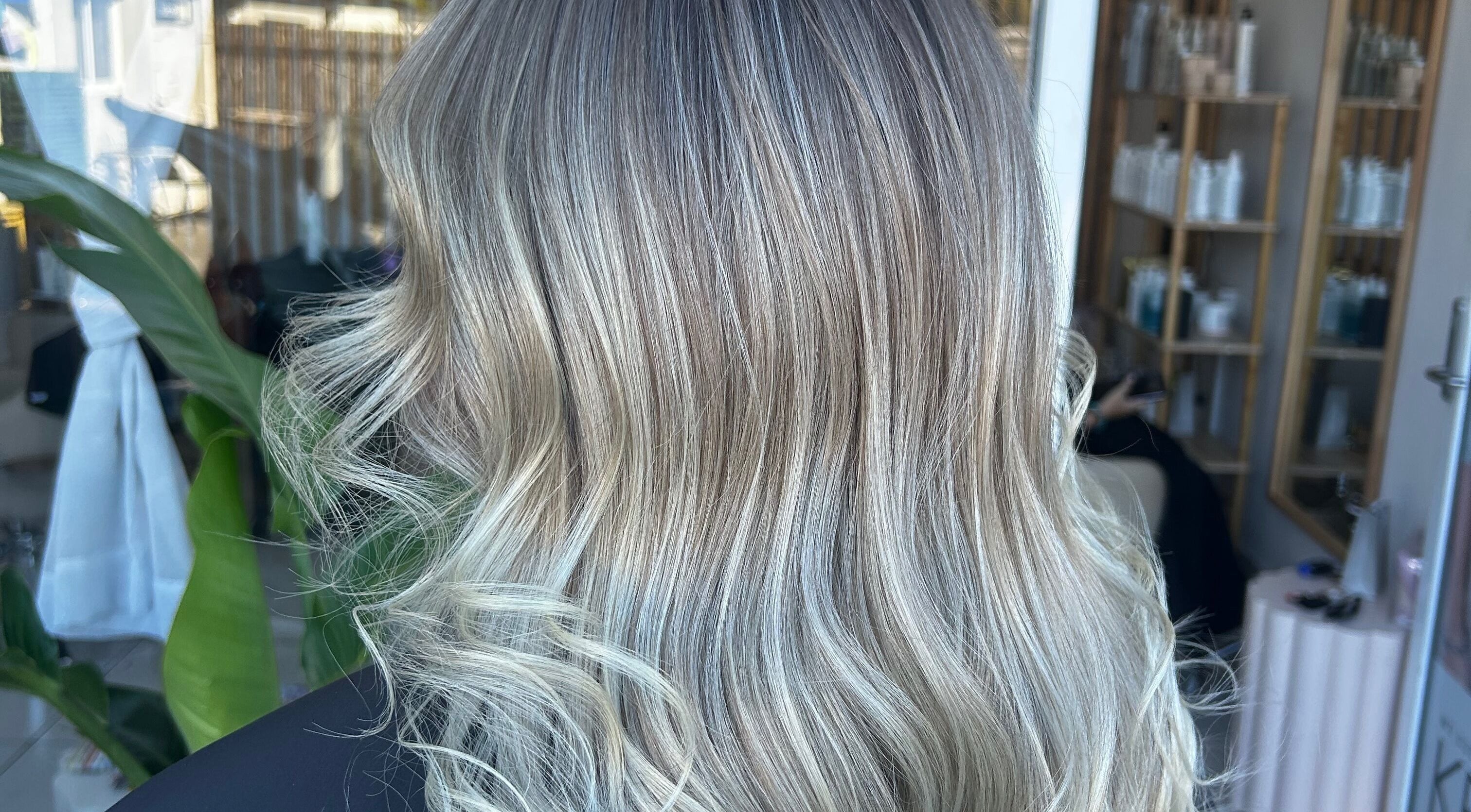 Blonde wavy hair styled at Tease by Laura, Budgewoi, New South Wales, AU, reflecting natural elegance.