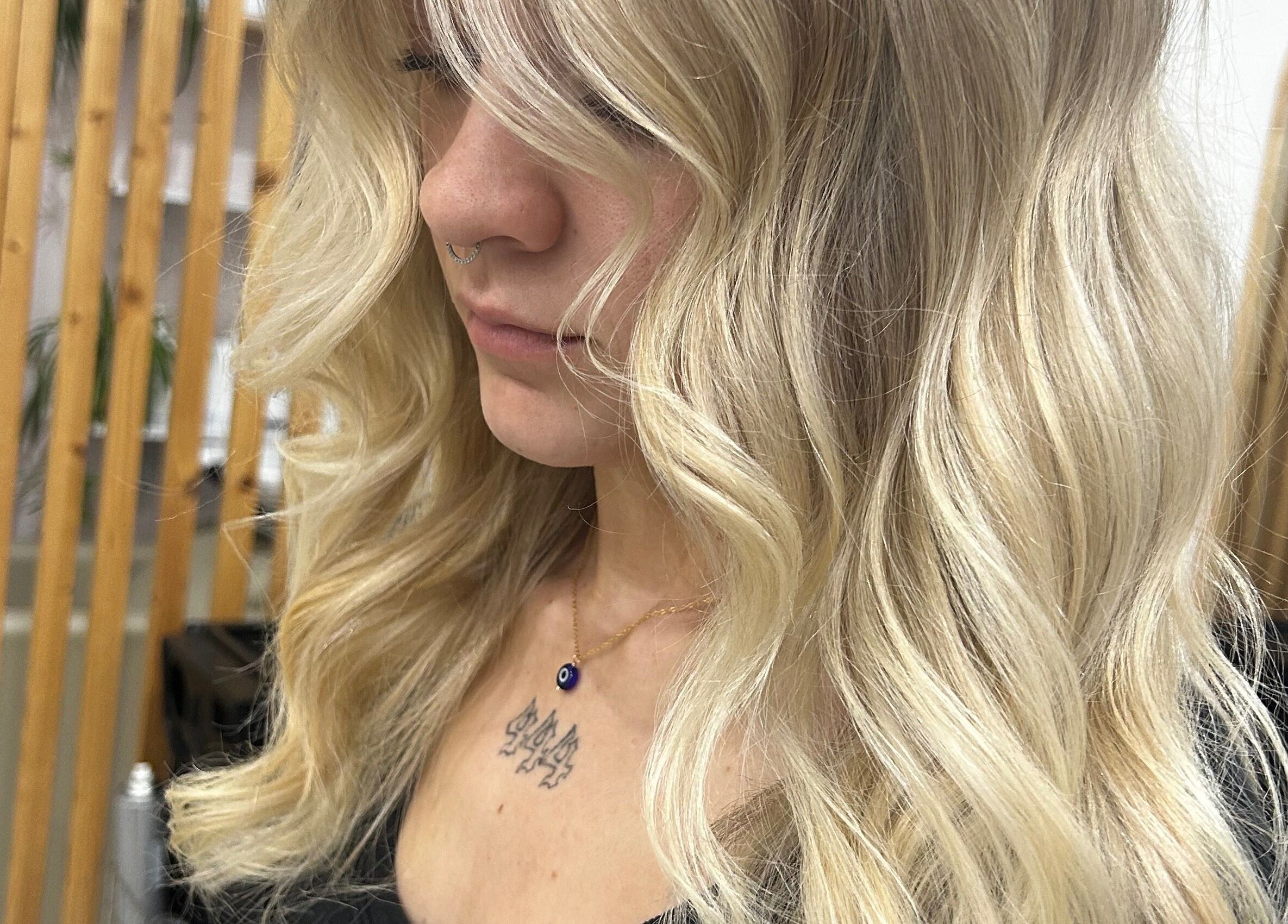 Elegant blonde hair styling at Tease by Laura, Budgewoi, New South Wales, AU, enhancing natural beauty.