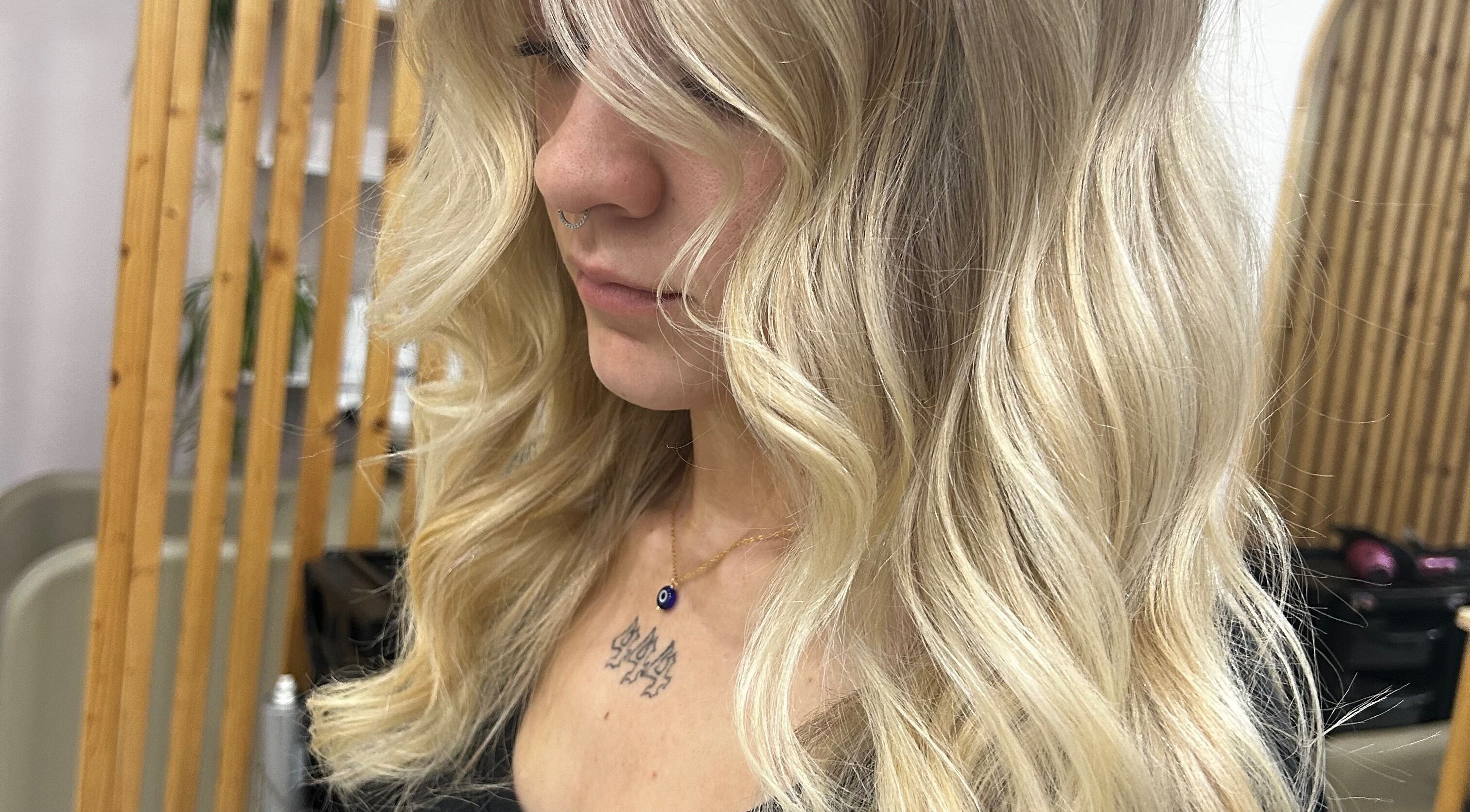 Elegant blonde hair styling at Tease by Laura, Budgewoi, New South Wales, AU, enhancing natural beauty.