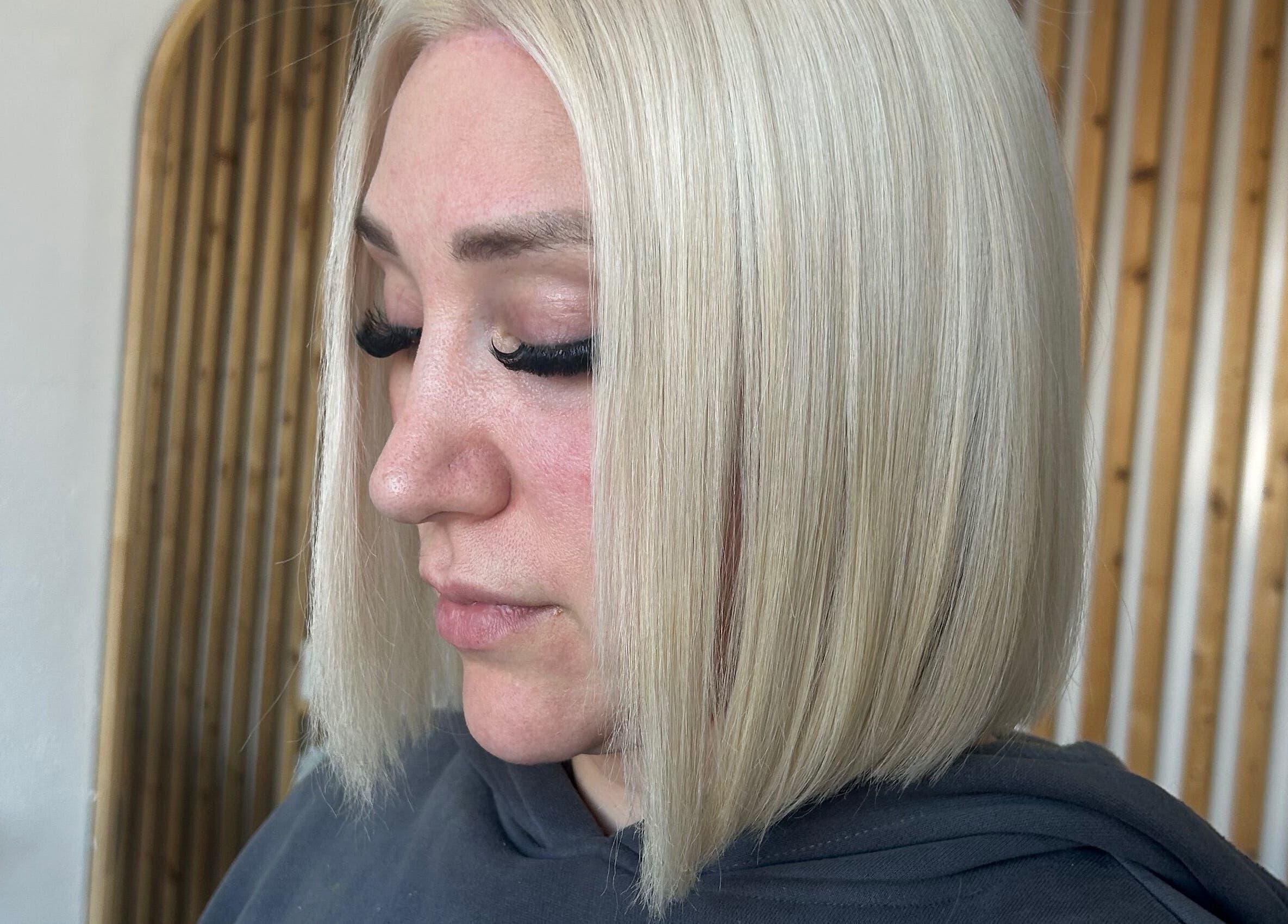 Close-up of stylish blonde bob haircut at Tease by Laura in Budgewoi, New South Wales, AU.