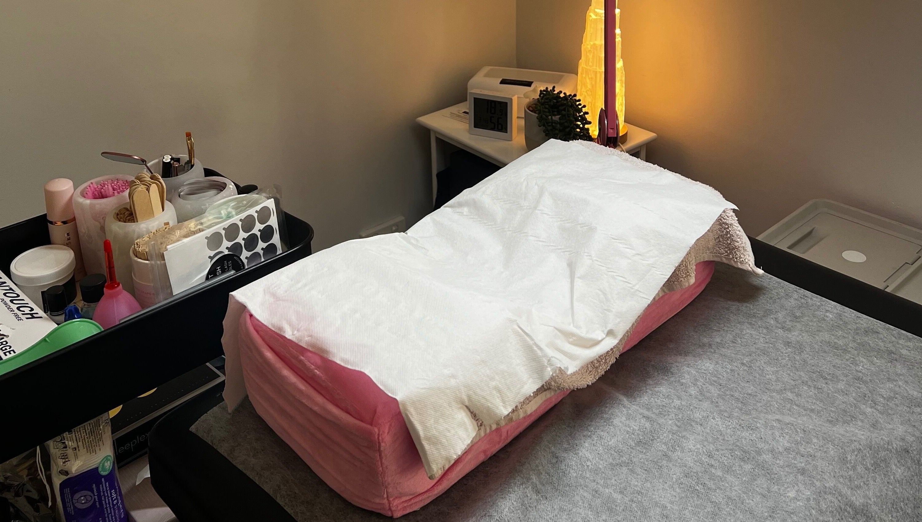 Cozy treatment room at A&E Aesthetics, Adelaide, South Australia, AU, featuring a plush therapy bed.