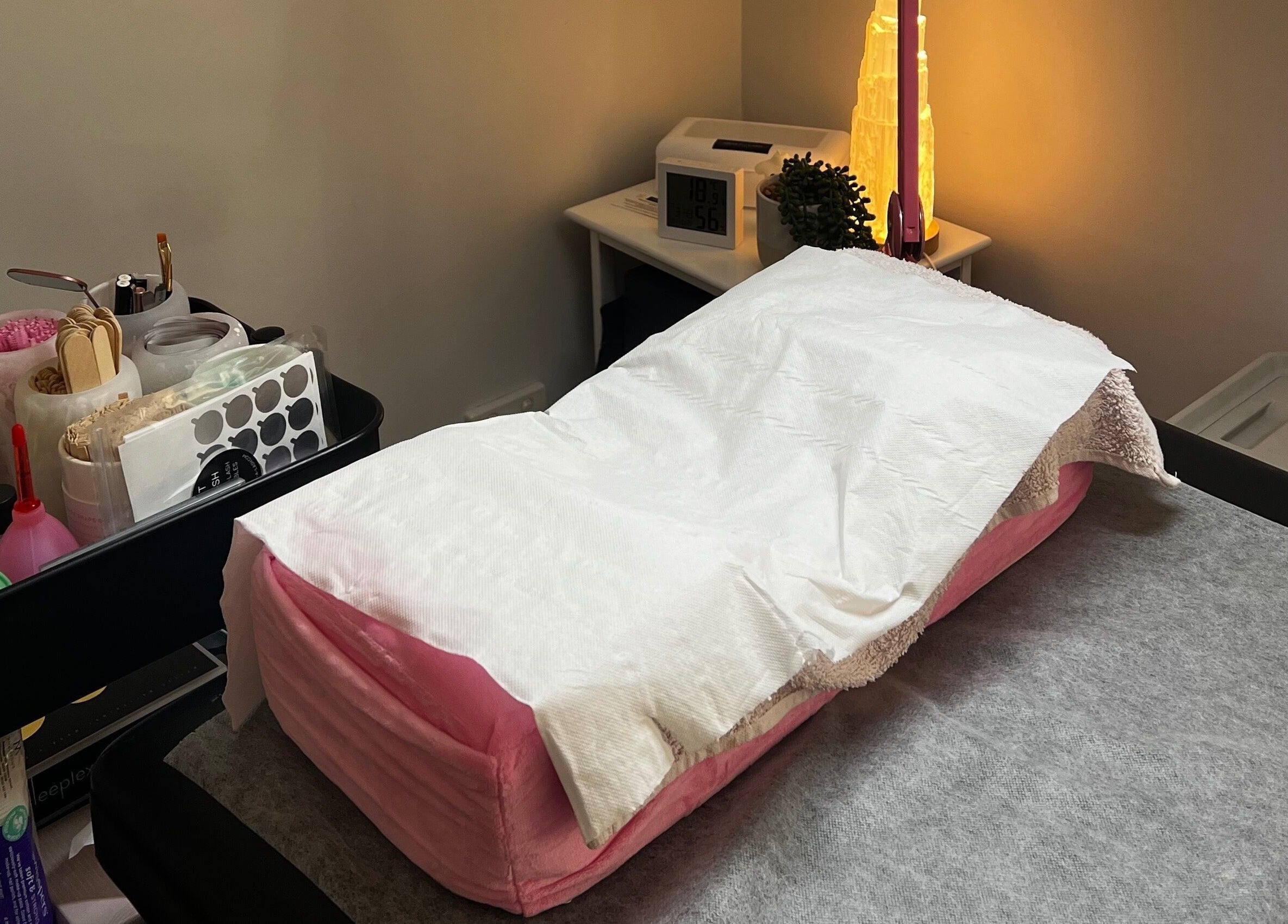 Cozy treatment room at A&E Aesthetics, Adelaide, South Australia, AU, featuring a plush therapy bed.