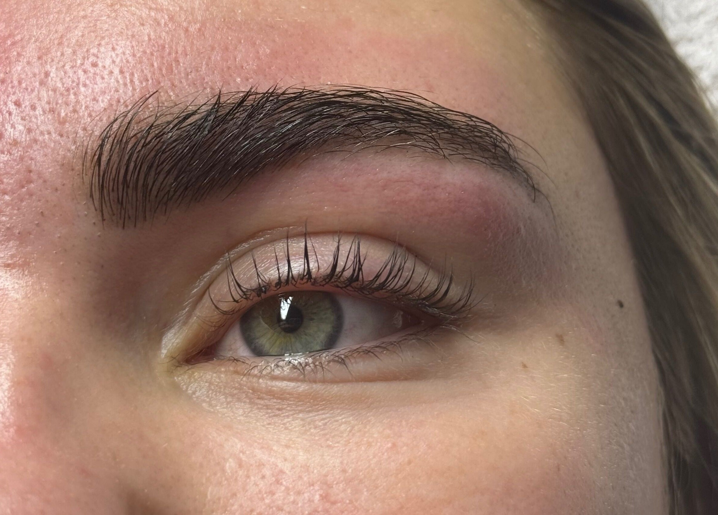 Close-up of perfectly shaped brows and lashes at A&E Aesthetics, Adelaide, South Australia, AU.