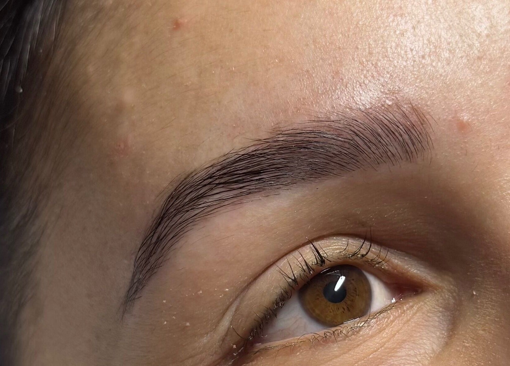 Close-up of perfectly groomed eyebrows at A&E Aesthetics, Adelaide, South Australia, AU.