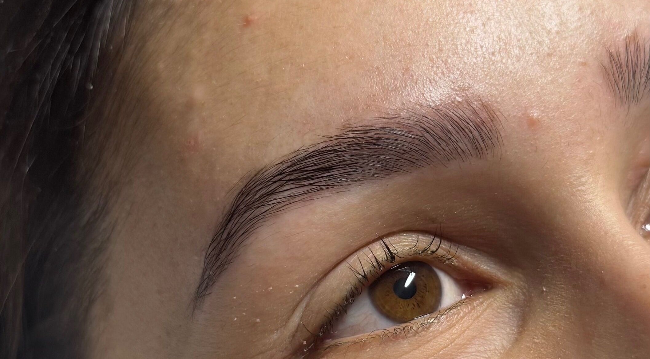 Close-up of perfectly groomed eyebrows at A&E Aesthetics, Adelaide, South Australia, AU.