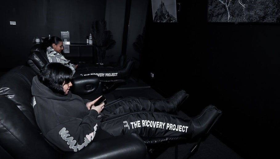 Comfortable relaxation chairs at Energize Recovery in Melbourne, Victoria, AU featuring therapy leg sleeves.