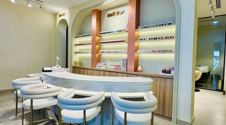 Chic nail bar inside Goldn Muse Beauty Salon, Dubai, Dubai, AE, featuring elegant seating and a wide polish selection.