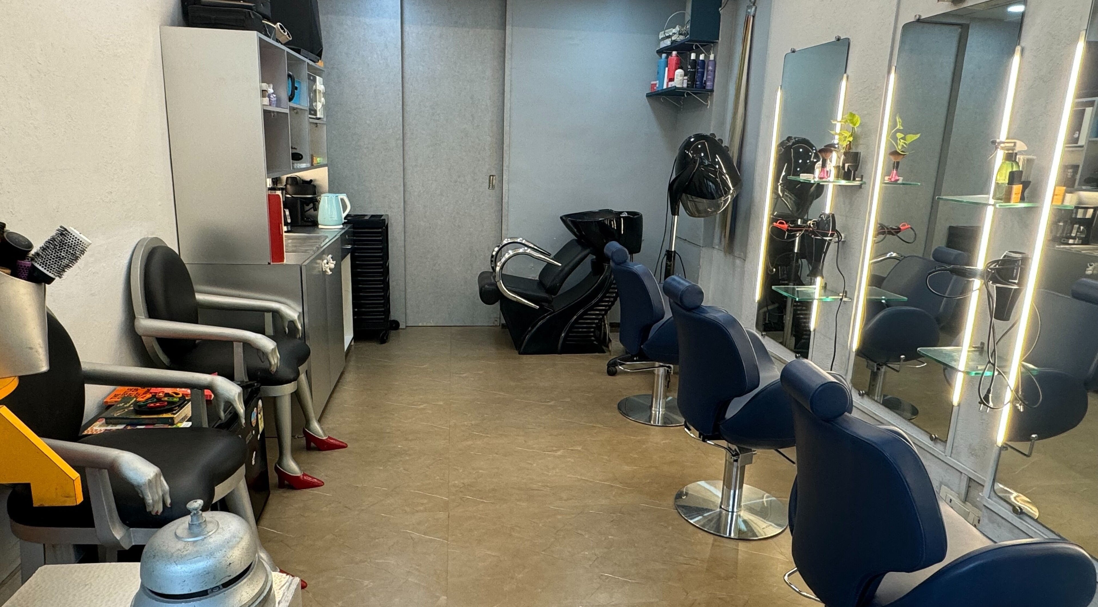 Sleek interior of The Head Space Salon, Mumbai, with modern styling stations and comfortable chairs.