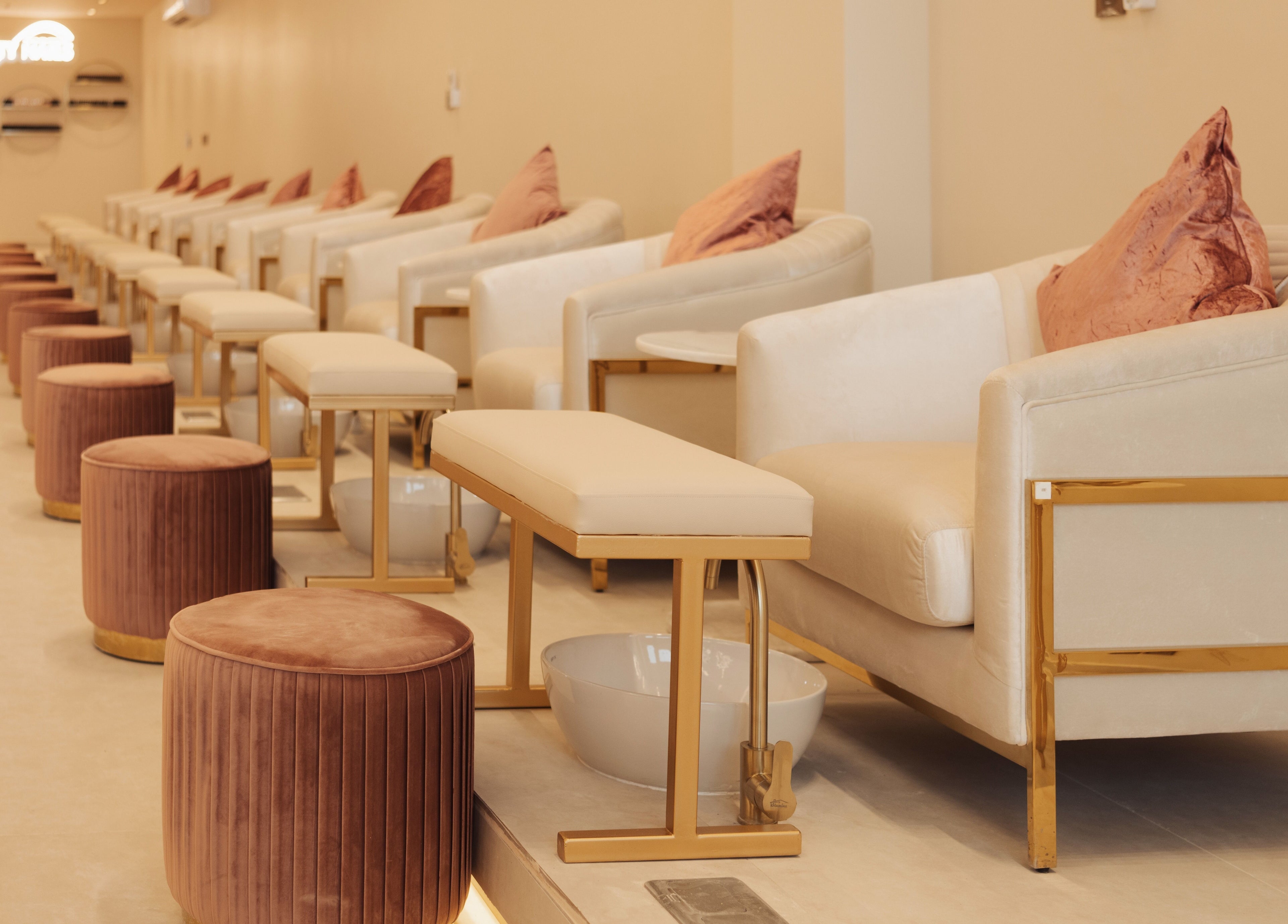 Infinity Nails interior with plush seating in Riyadh, Riyadh Province, SA offering premium nail services.