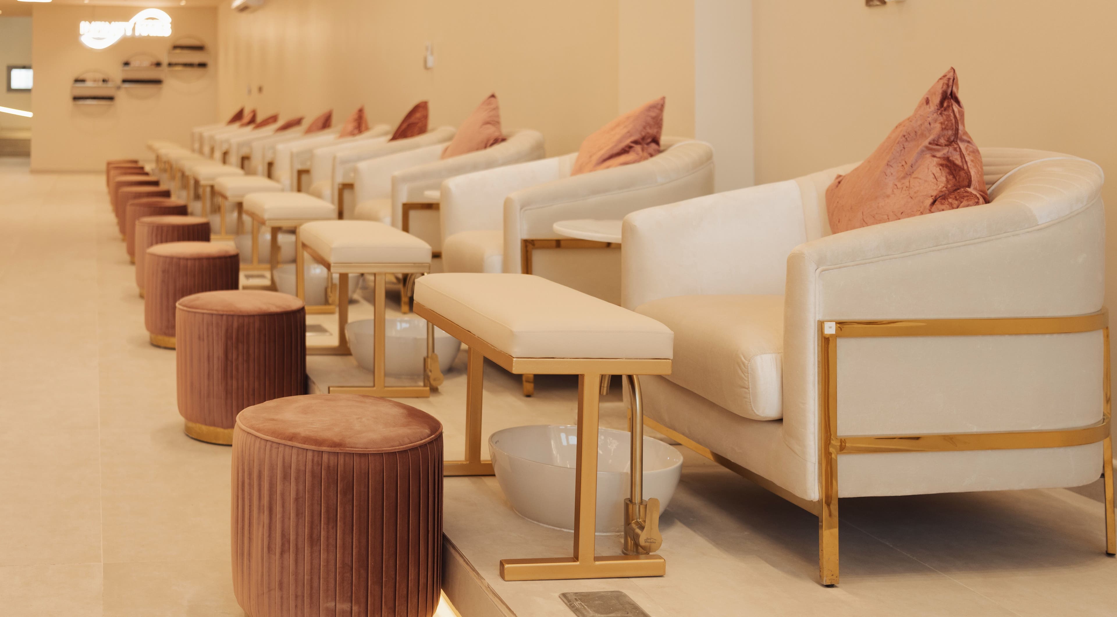 Infinity Nails interior with plush seating in Riyadh, Riyadh Province, SA offering premium nail services.