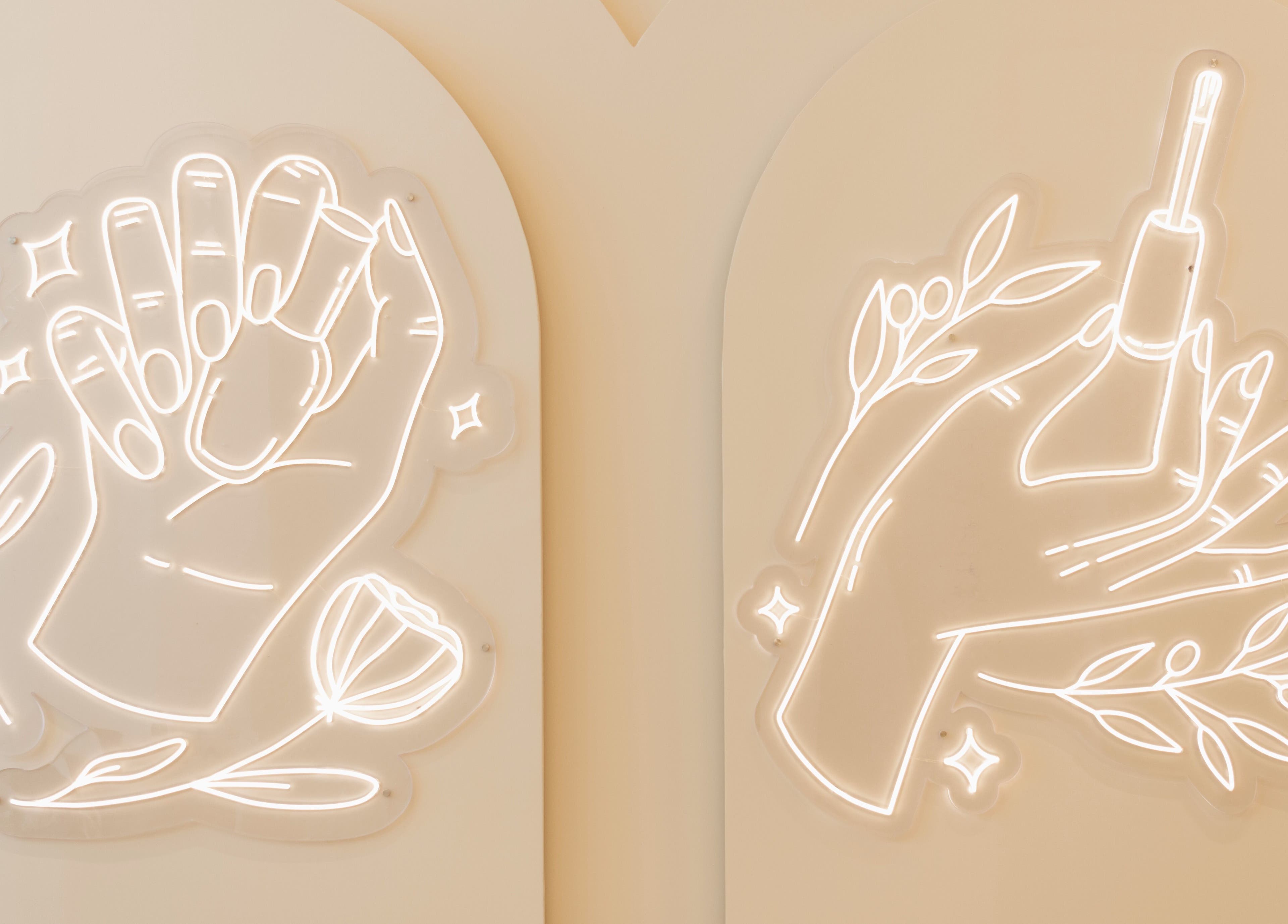 Neon hand art decorates walls at Infinity Nails in Riyadh, Riyadh Province, SA.