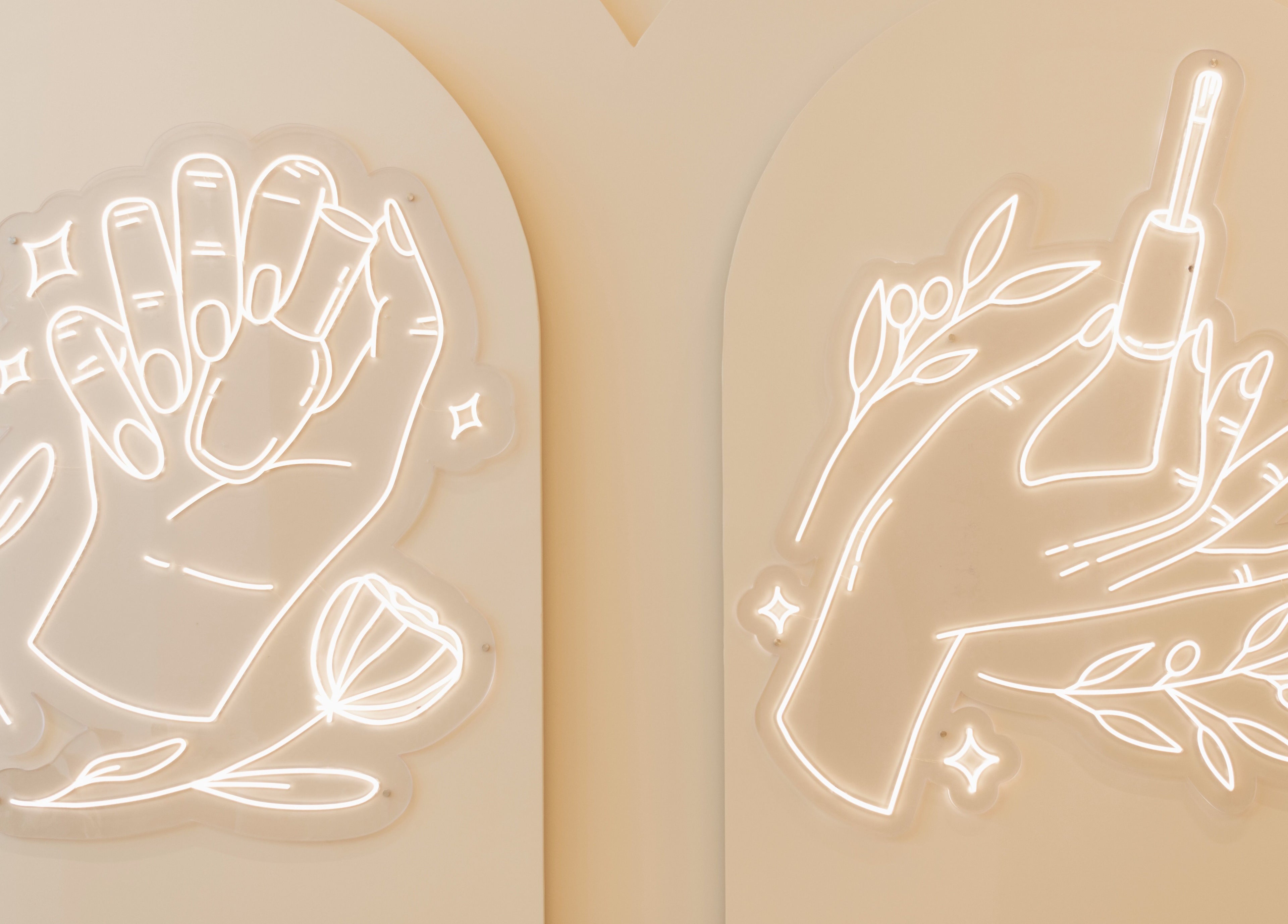 Neon hand art decorates walls at Infinity Nails in Riyadh, Riyadh Province, SA.