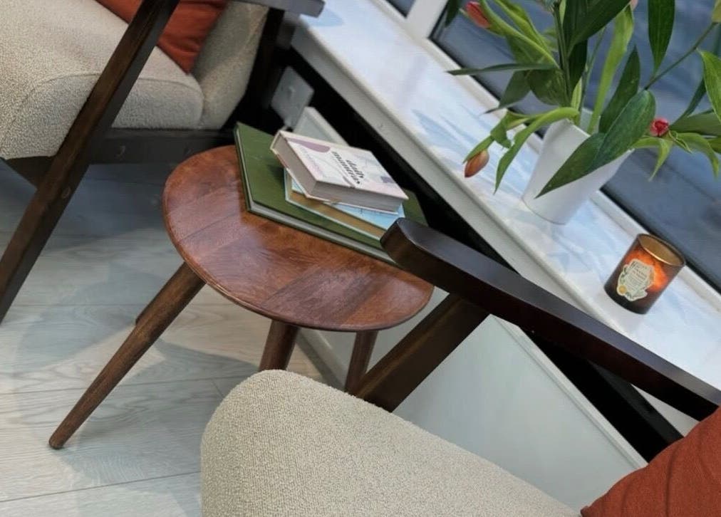 Cozy seating area at Hair by Izzy, Harrogate, England, GB, featuring elegant decor and comfortable furniture.