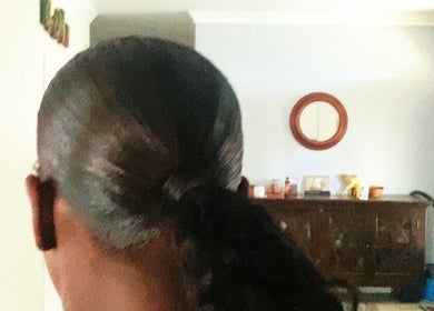 Sleek, styled hair showcasing hair care at Saloon Cornucopia, Nassau, New Providence, BS.