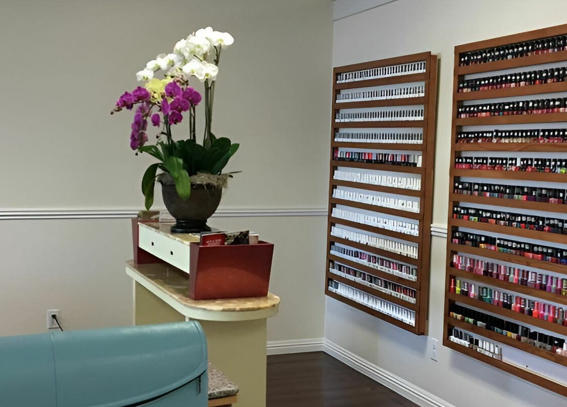 Chic nail polish display at Blue Bell Nails Salon, Livermore, California, US showcasing vibrant colors in stylish decor.