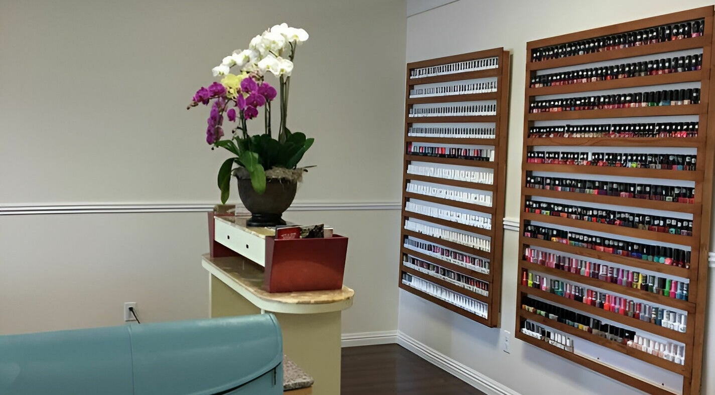 Chic nail polish display at Blue Bell Nails Salon, Livermore, California, US showcasing vibrant colors in stylish decor.