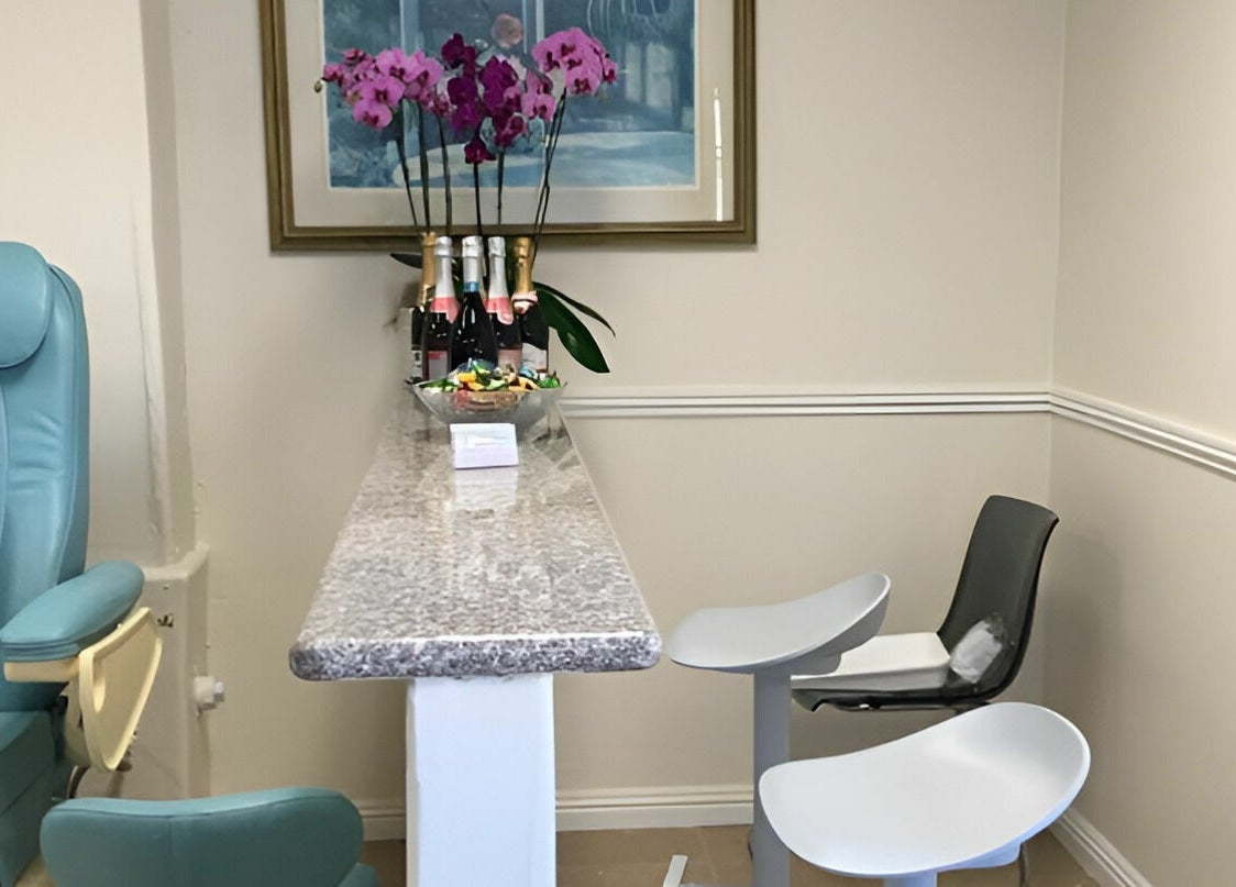 Luxurious seating with decor accents at Blue Bell Nails Salon, Livermore, California, US.