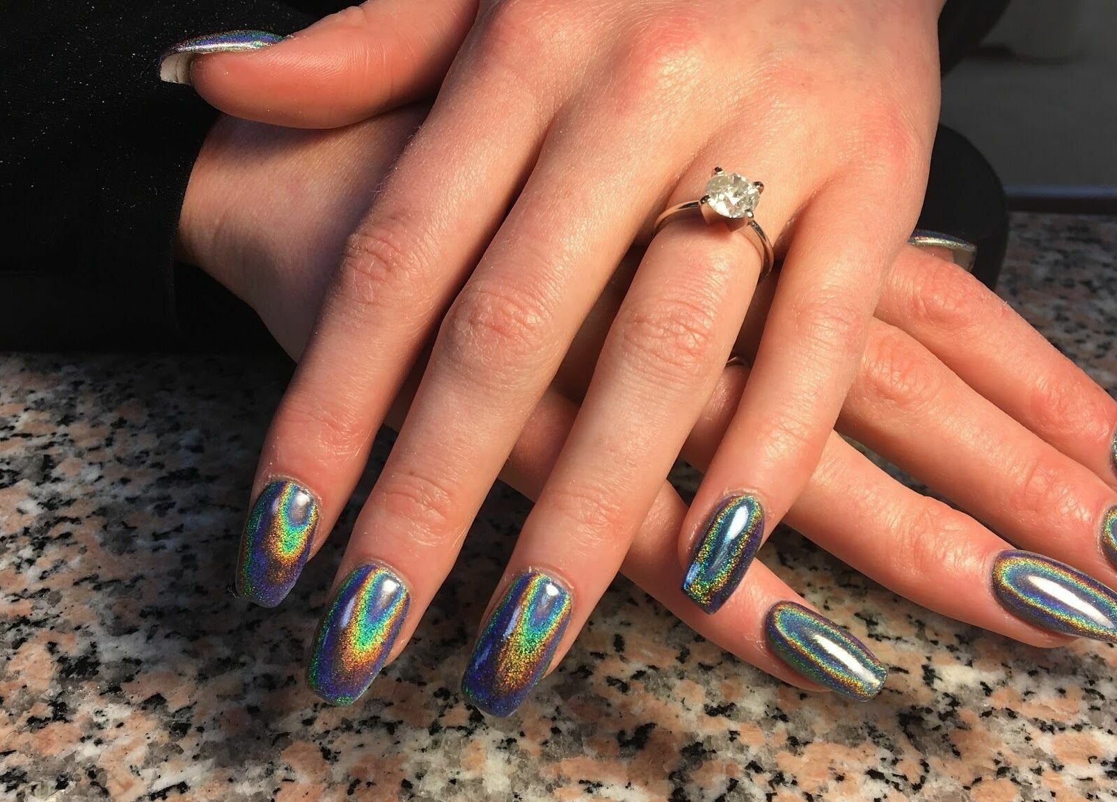 Holographic nails at Blue Bell Nails Salon in Livermore, California, US, showcasing shimmering artistry.