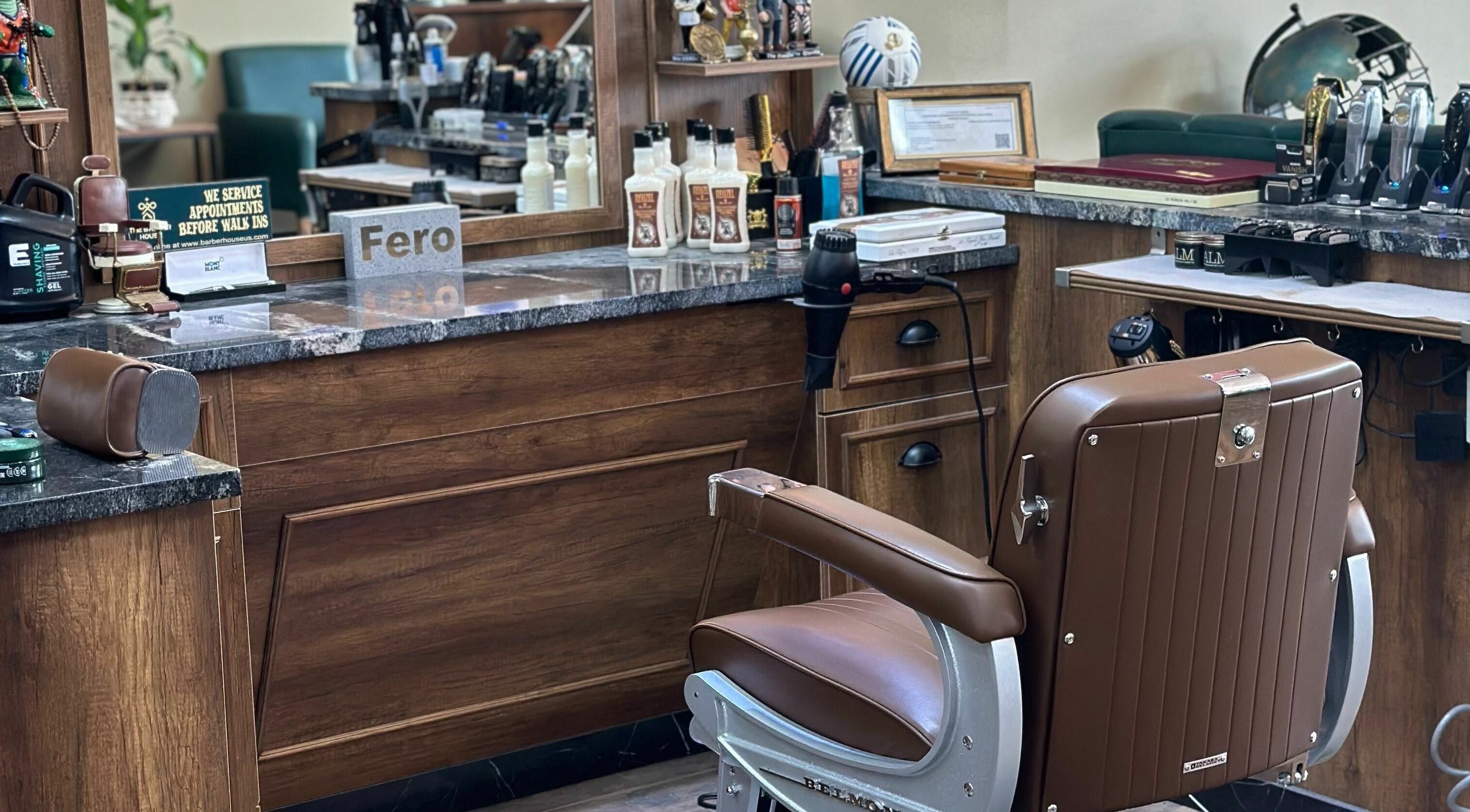 Sophisticated interior of The Barber House, Orlando, Florida with stylish barber chair and grooming tools.