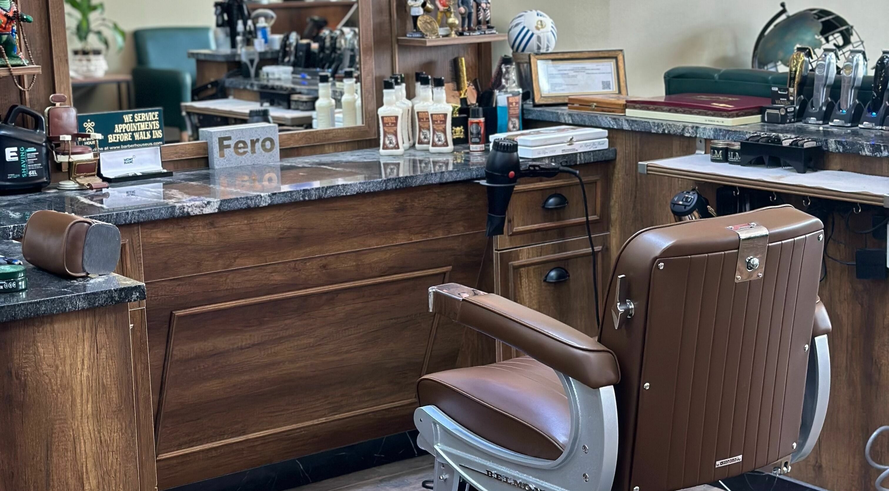 Sophisticated interior of The Barber House, Orlando, Florida with stylish barber chair and grooming tools.