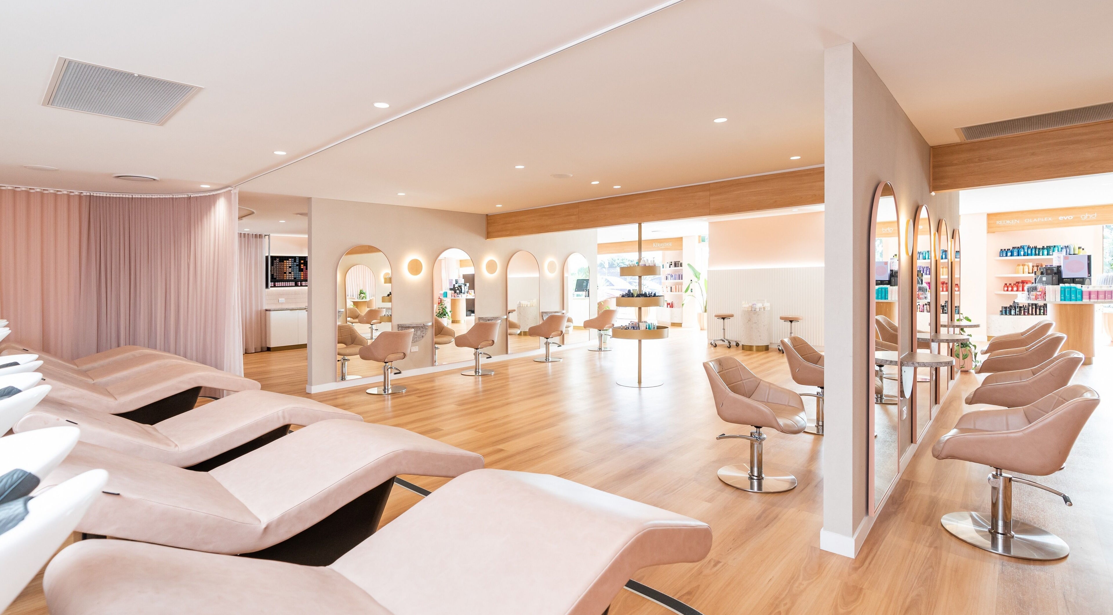 Chic salon interior at C'ba Hair, Capalaba, Queensland, AU featuring modern chairs and stylish mirrors.