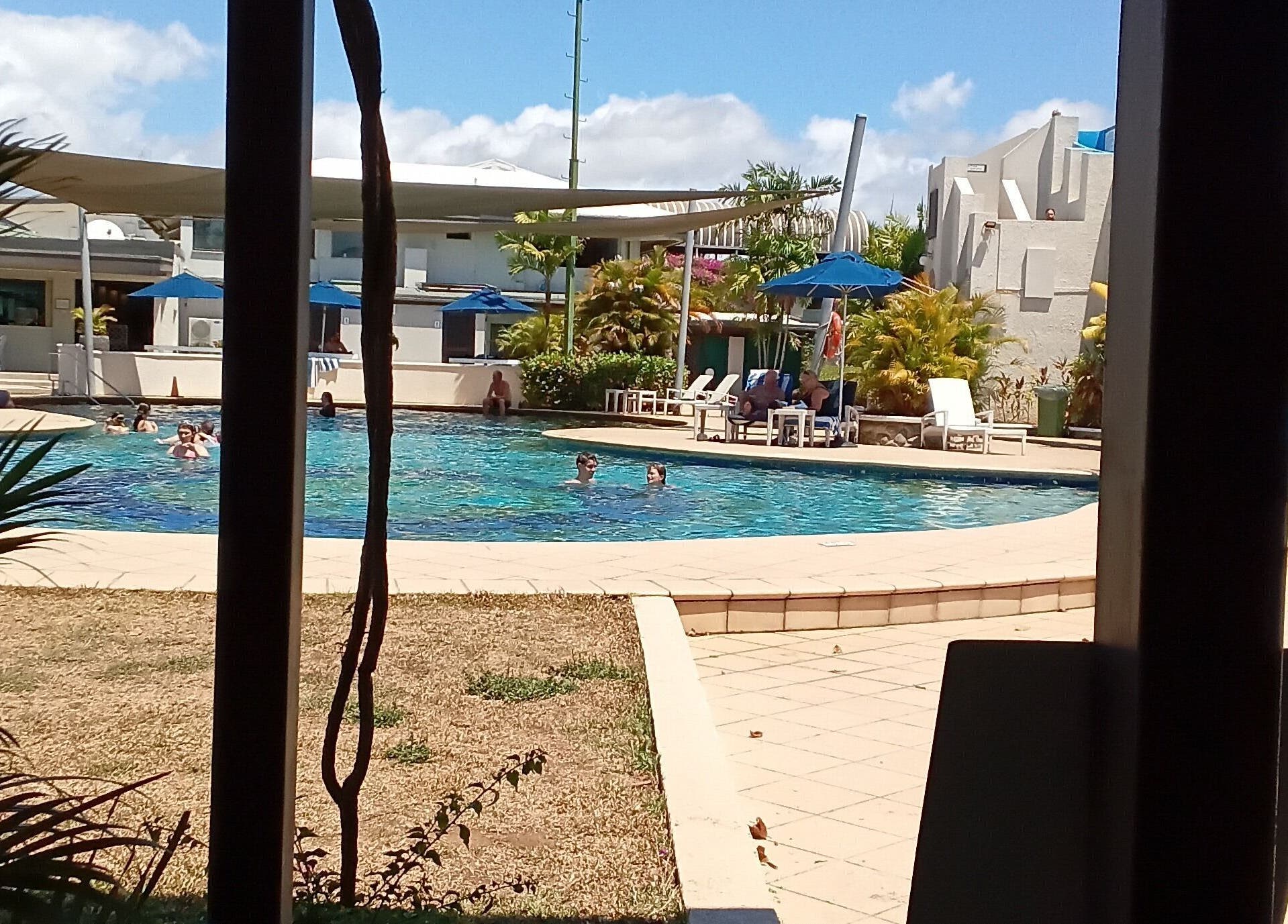 Relax by the pool at Nama Fiji, Nadi, Western Division, FJ with sunny skies and lush surroundings.