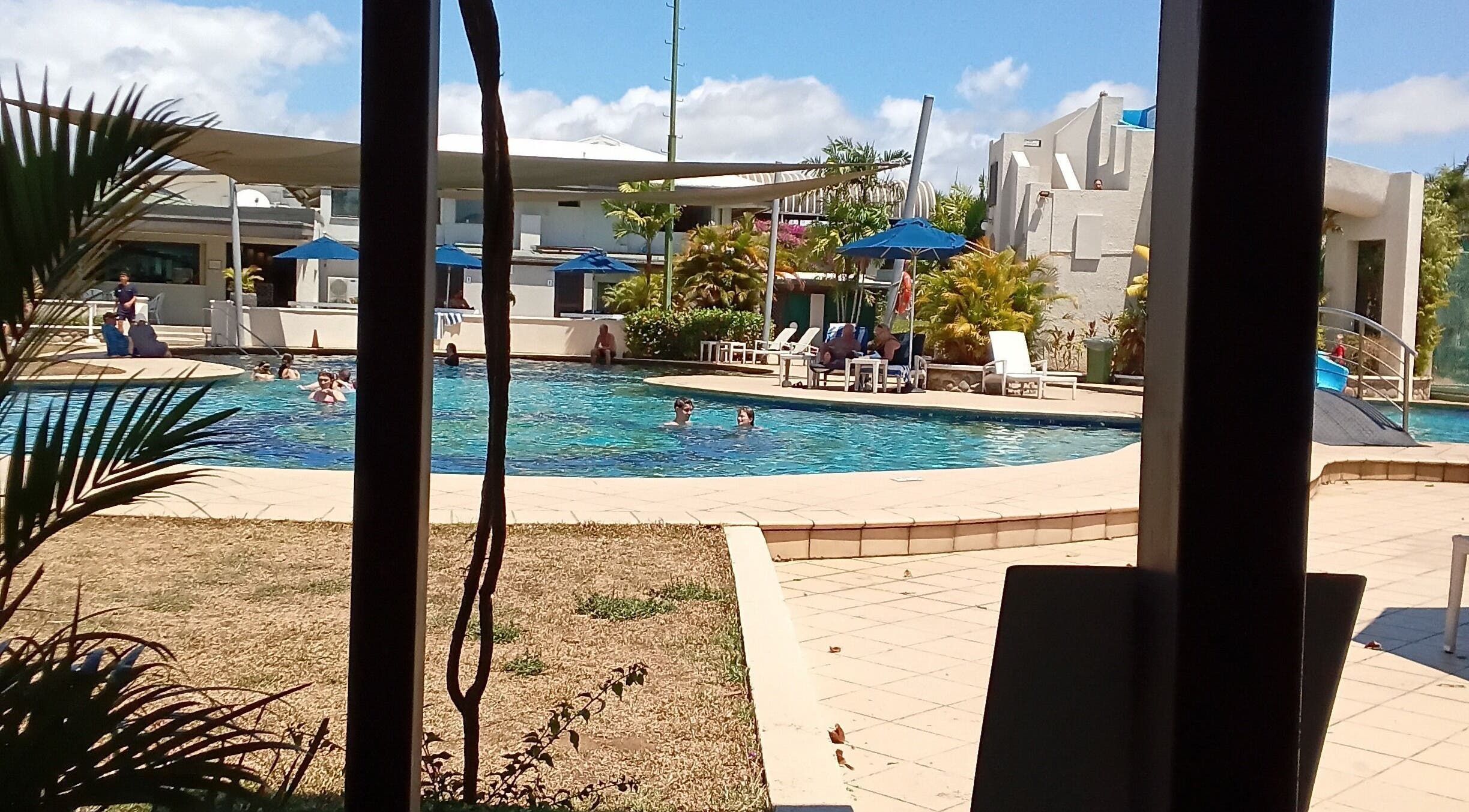 Relax by the pool at Nama Fiji, Nadi, Western Division, FJ with sunny skies and lush surroundings.