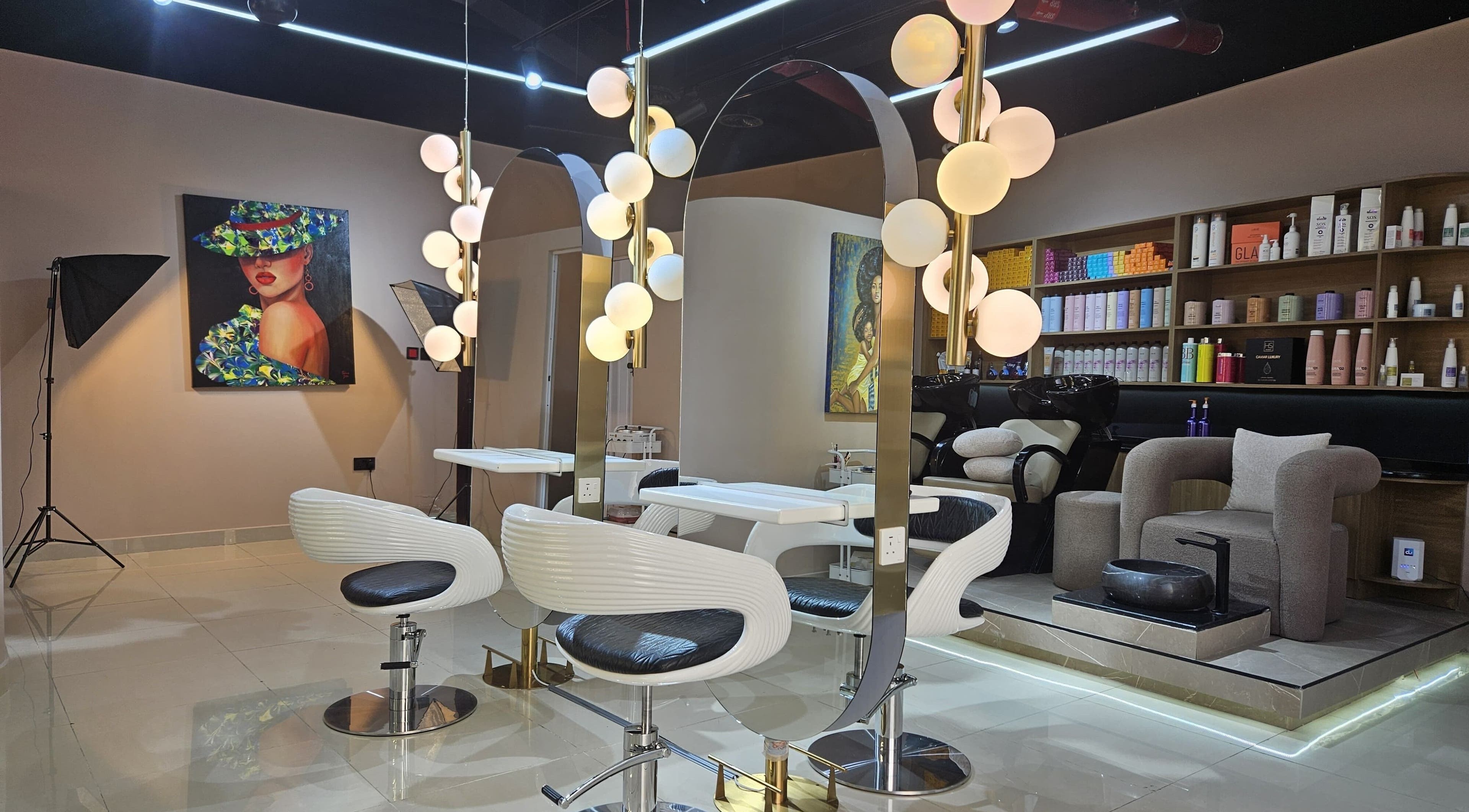 Stylish interior of Mahla Beauty Salon in Dubai, Dubai, AE showcasing chic styling chairs and modern lighting.