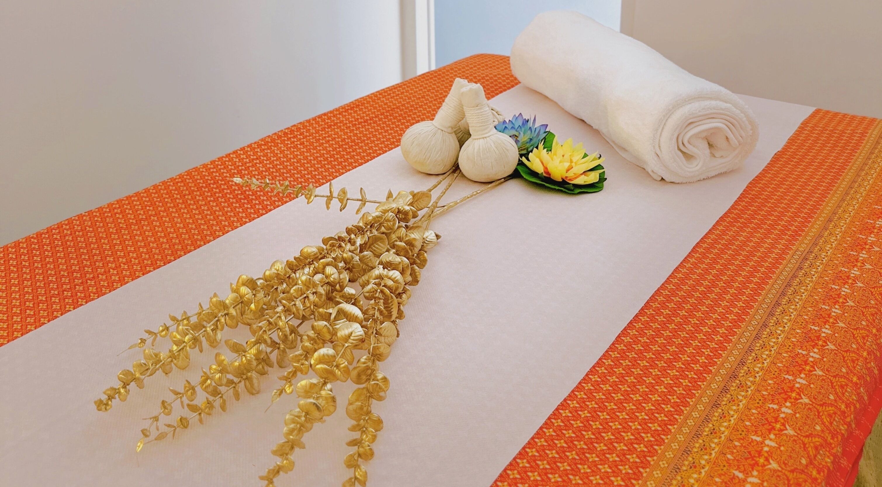 Elegant massage table setup with herbs at Thaiger Thai Massage & Spa, Dartford, England, GB.